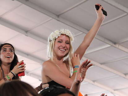 A blonde girl in the audience at Coachella 2013