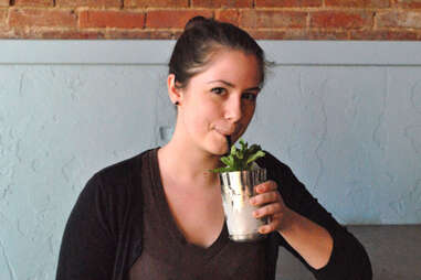 A patron drinks a mint julep at Silver Dollar Louisville