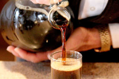 Brewer pouring Kentucky Bourbon Barrel Stout