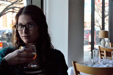 A patron sips a cocktail at Harvest in Louisville