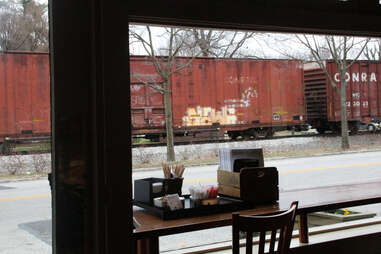 Trains passing down Frankford Ave outside Blue Dog Bakery in Louisville, KY