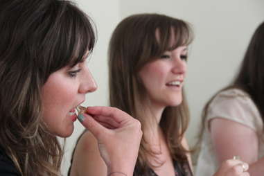 Ladies tasting gummy bears