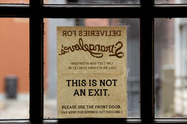 A zombie sign on the window of Strangelove's