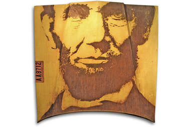 Abraham Lincoln's face, rusted onto a classic car hood