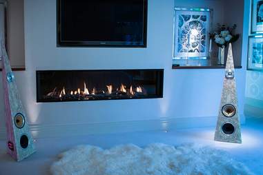 Speakers from Rinz Sound near a fireplace