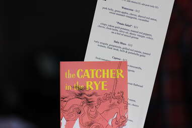 Catcher in the Rye holds a menu at Renegade Publik House