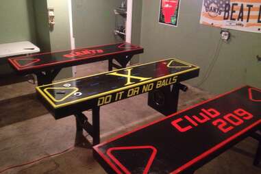 Beer pong table with automatic ball washers