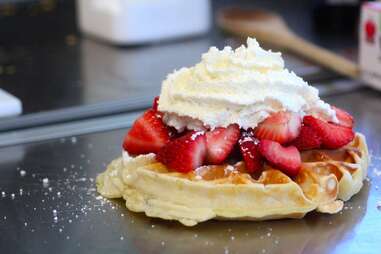 Strawberry and whipped cream-topped waffle from Waffle Wagon in Seattle