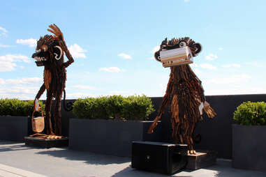 Wooden statues on the Revere Hotel's roofdeck