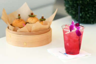 Hibiscus Rum Punch and basket of sliders at the Revere Hotel