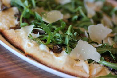 cheese on a pizza at Live Basil