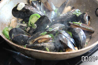 mussels cooking in a pan with butter