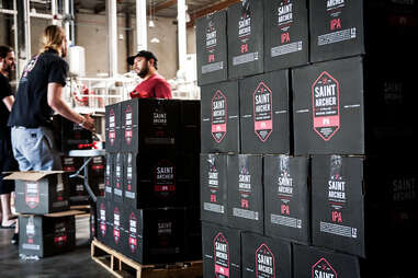 Capping bottles of Saint Archer IPA at Saint Archer Brewery in San Diego.
