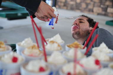 guy eats a strawberry banana shake at Sonic