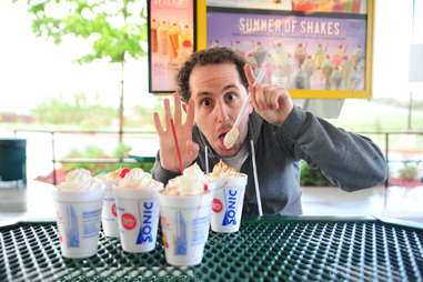 guy eats a coconut cream pie milkshake at Sonic