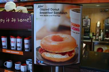 Dunkin Donuts glazed donut breakfast sandwich sign