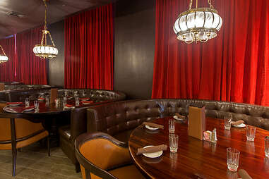 Leather booths in dining room at Carrie Nation Cocktail Club
