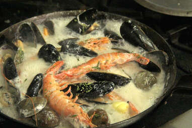 Clam, mussel, shrimp, and prawn shellfish waterzooi at Noord