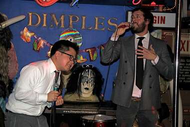 Man singing karaoke at Dimples in Los Angeles