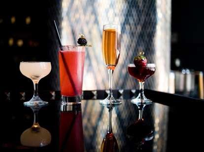 Four assorted specialty cocktails.