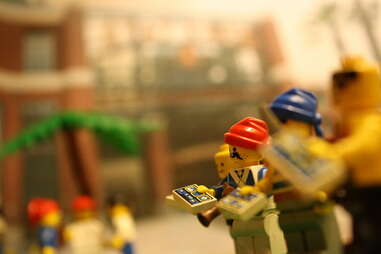 lego people handing out paper