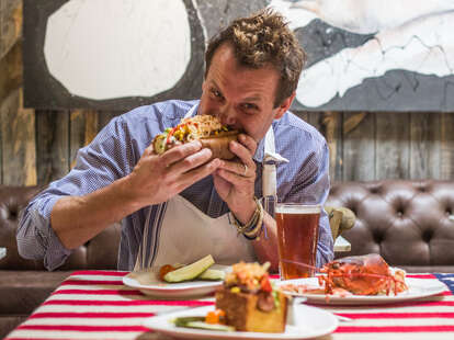 Chef Brian Malarkey eating his hot dog