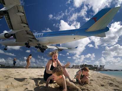 women and children cower at St. Marteen airport