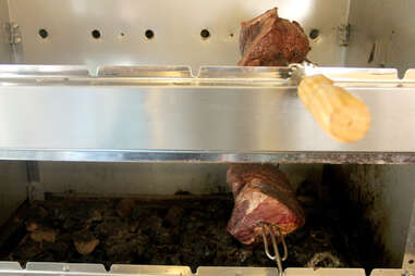 The rotating skewers of beef inside the Braz BQ Truck