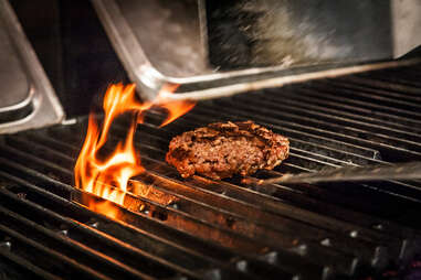 100% bacon patty on the grill at Slater's 50/50 in San Diego.