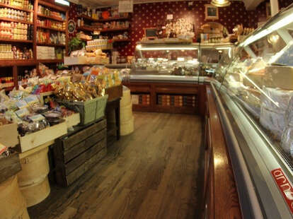 Interior of bedford cheese with a hundreds of cheeses and hard wood floors.