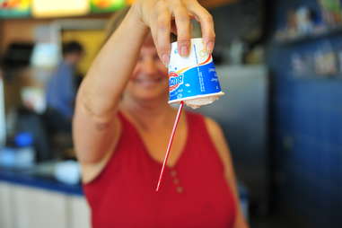 a woman holding a Blizzard upside down