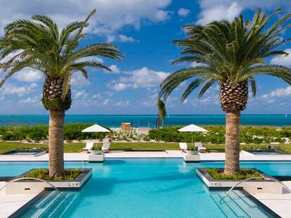 Grace Bay Club palm trees and pool