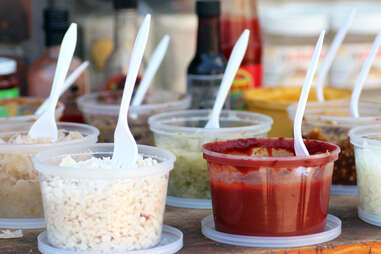 Table of condiments at Formaggio Kitchen