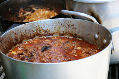 Boiling pot of pulled meat at Formaggio Kitchen