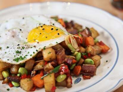 Hash of Japanese & American sweet potatoes with a fried duck egg.