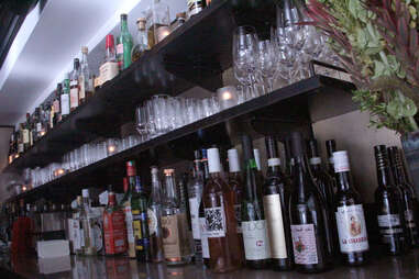 Wine bottles behind the bar at a.bar