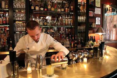 bartender pouring a cocktail