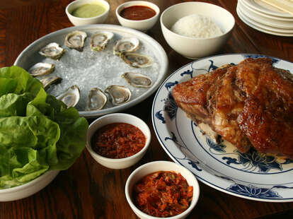 Momofuku Ssam Bar's whole pork butt Bo Ssam with oysters and kimchi