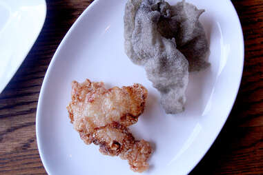 Momofuku Ssam Bar's beef tendon and black garlic chips.