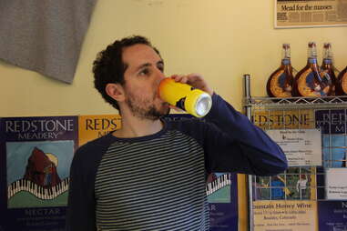 guy drinking Redstone Meadery can of mead