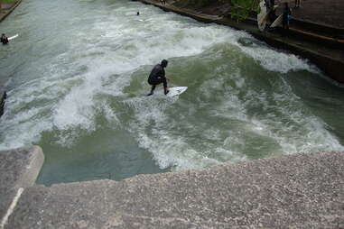 River surfing the Eisbach River in Munich Germany.