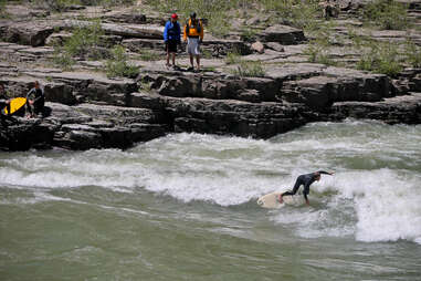 River surfing the Snake River in Wyoming