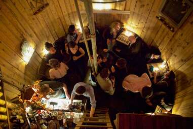 people drinking in a watertower speakeasy