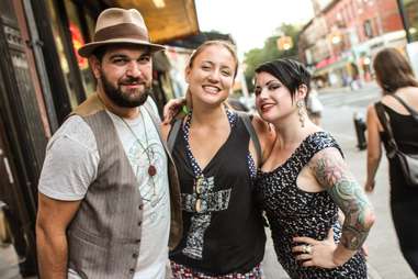 Man with a hat and two women