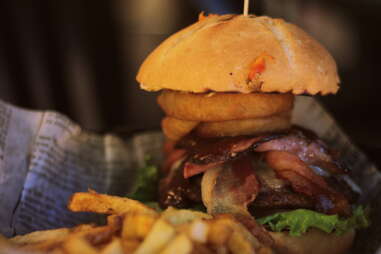 Burger with onion rings and fries