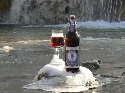 A beer by a frozen stream
