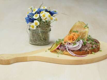 wooden paddle with food on it