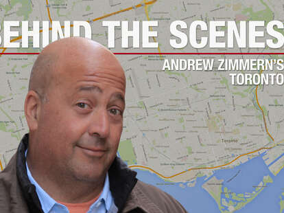 Andrew Zimmern in front of a map