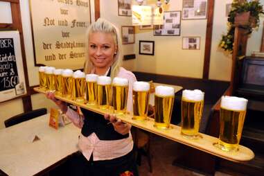 Woman holding a lot of beers