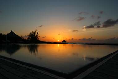  Infinity pool sunset at Parrot Cay by COMO